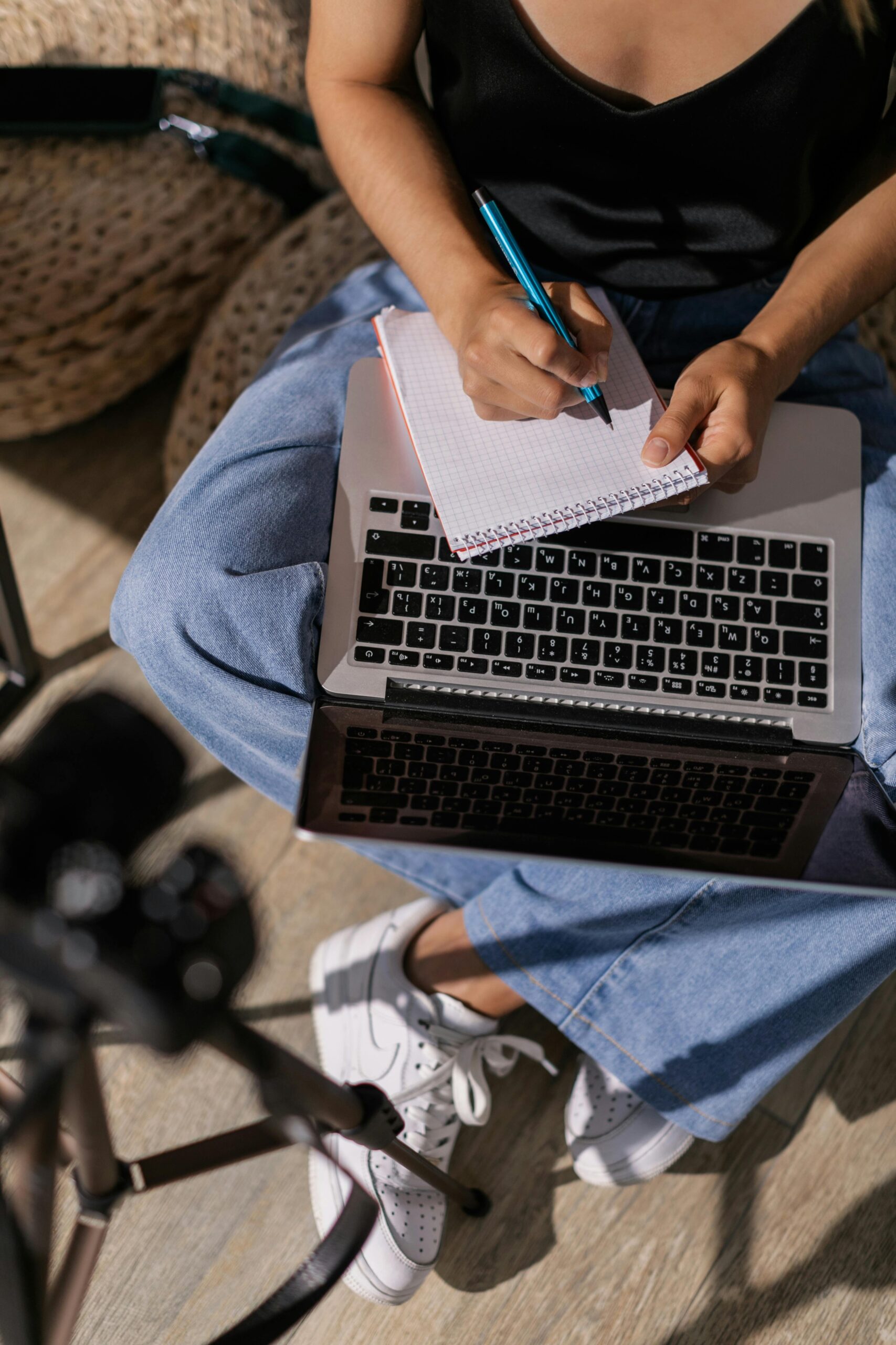 Person writing blog post on laptop to make money online