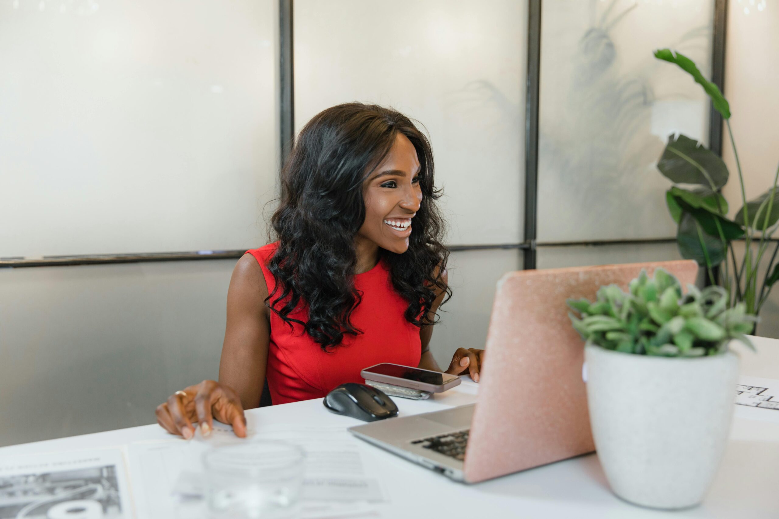 Small business owner woman working on laptop at desk