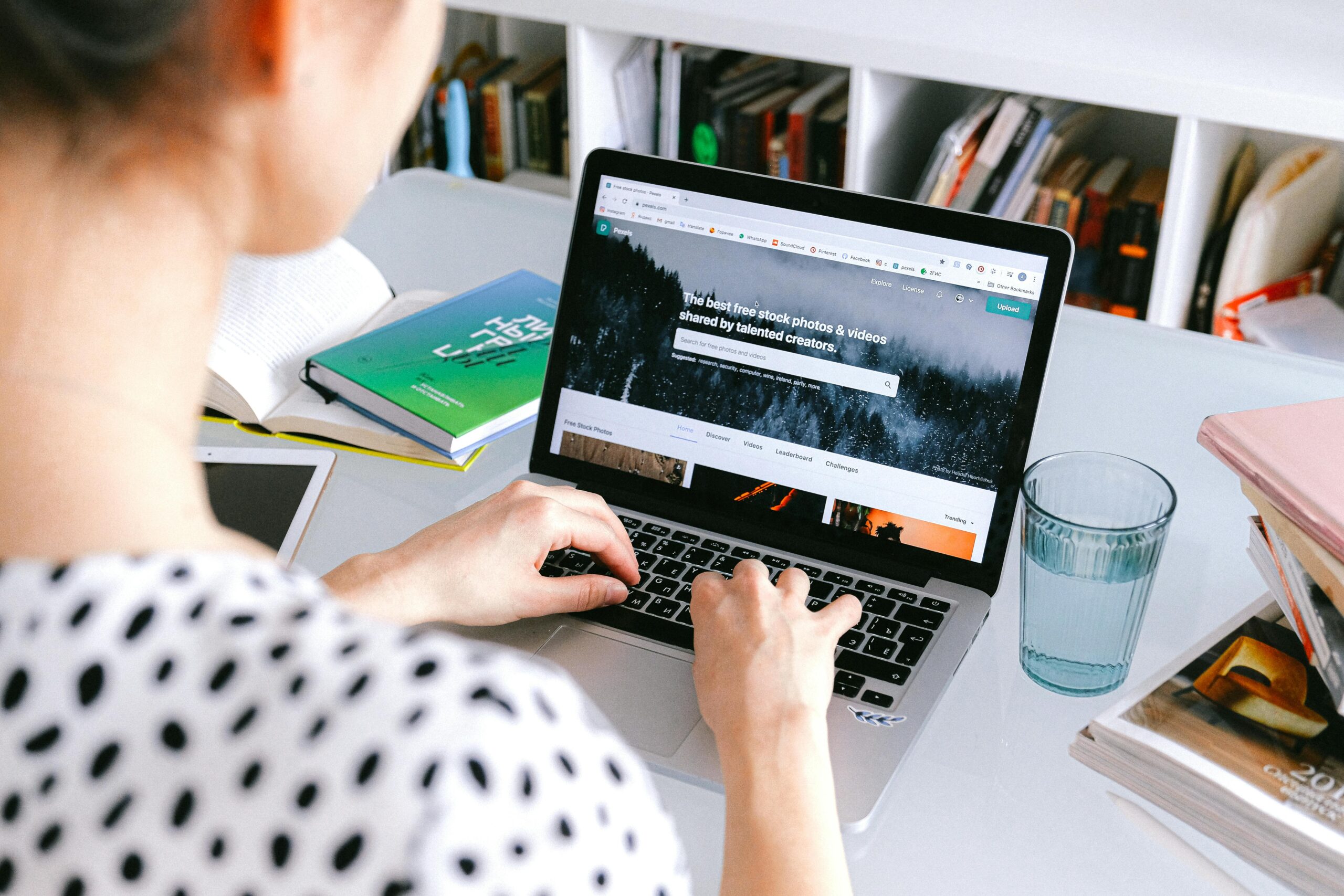 Woman learning online on laptop at home desk